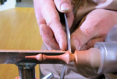 Turning a paduk finial for the lid of his pot